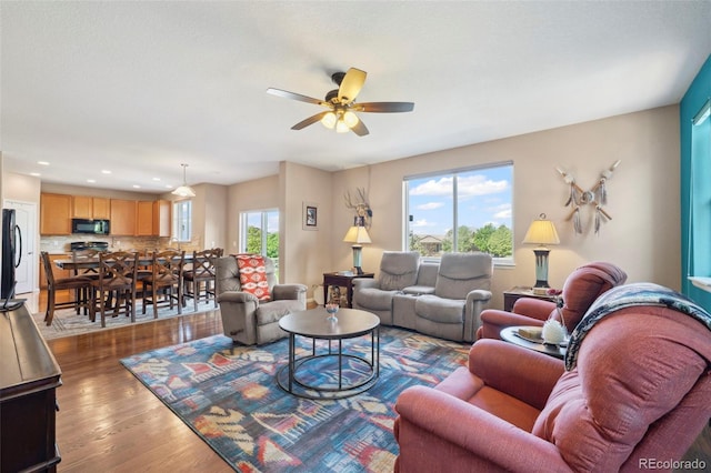 6612 Big Leaf Ln, Colorado Springs, CO 80927 - living area with wood finished floors, ceiling fan, and recessed lighting