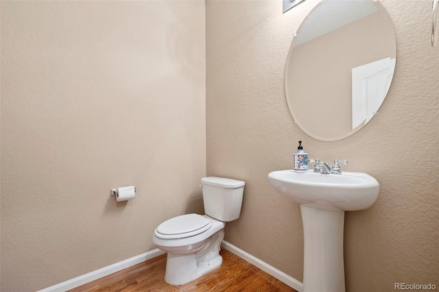 6612 Big Leaf Ln, Colorado Springs, CO 80927 - half bathroom featuring wood finished floors and toilet