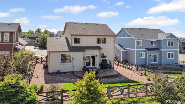6612 Big Leaf Ln, Colorado Springs, CO 80927 - back of house featuring stucco siding, a residential view, a fenced backyard, and a patio area