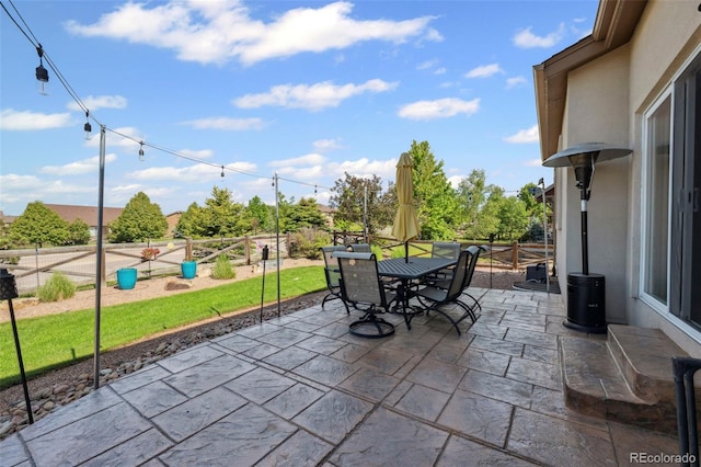 6612 Big Leaf Ln, Colorado Springs, CO 80927 - fenced backyard featuring a patio area and outdoor dining space
