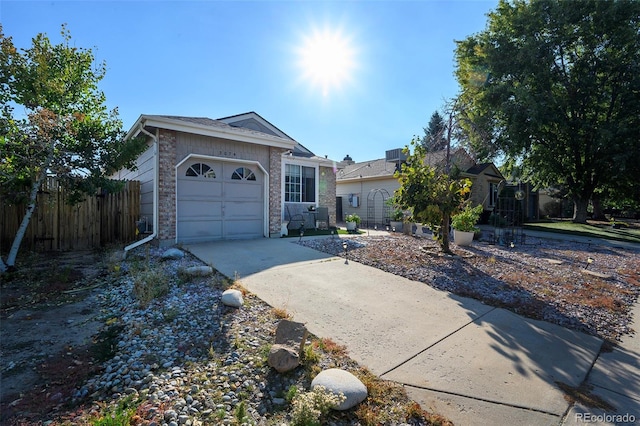 ranch-style home featuring a garage