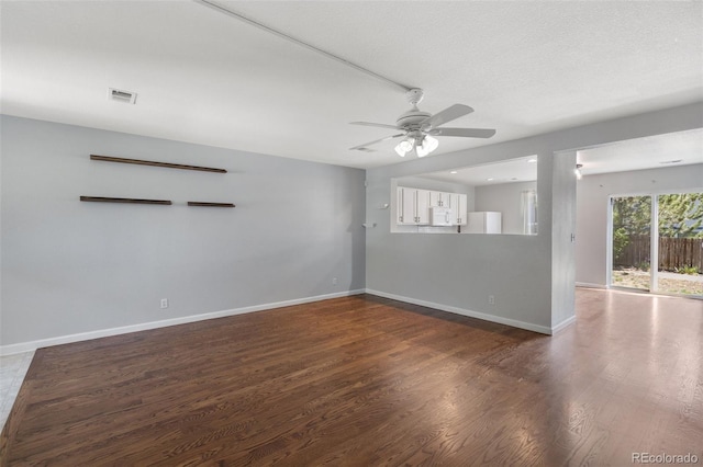 11050 Gaylord St, Northglenn, CO 80233 - unfurnished room featuring ceiling fan, dark wood-style flooring, and baseboards