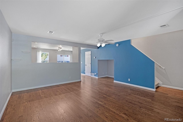 11050 Gaylord St, Northglenn, CO 80233 - unfurnished living room with wood finished floors, baseboards, stairway, and a ceiling fan