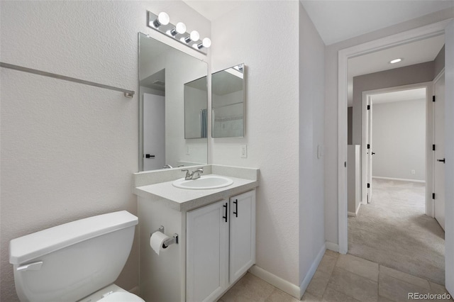 11050 Gaylord St, Northglenn, CO 80233 - bathroom with vanity, toilet, baseboards, and tile patterned floors