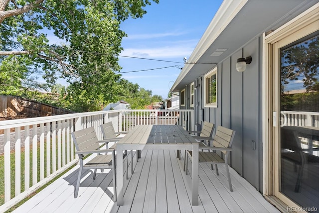 4381 Dixon Dr, Westminster, CO 80031 - wooden terrace with outdoor dining space