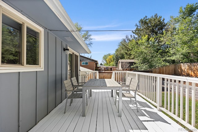 4381 Dixon Dr, Westminster, CO 80031 - wooden terrace featuring outdoor dining area