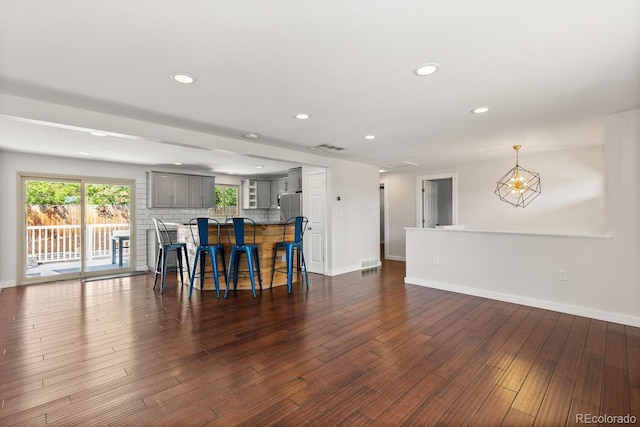 4381 Dixon Dr, Westminster, CO 80031 - living room with dark wood-style floors, baseboards, recessed lighting, and a chandelier