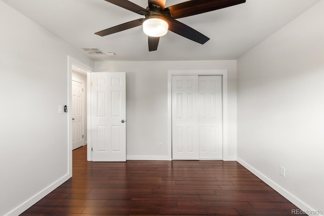4381 Dixon Dr, Westminster, CO 80031 - unfurnished bedroom with baseboards, dark wood-style flooring, a closet, and a ceiling fan