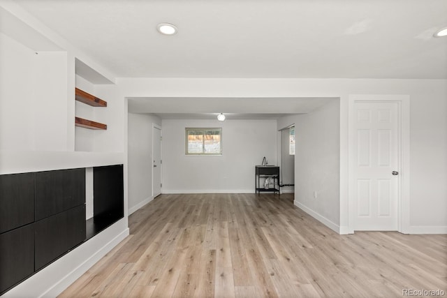 4381 Dixon Dr, Westminster, CO 80031 - unfurnished living room with light wood-style flooring, baseboards, and recessed lighting
