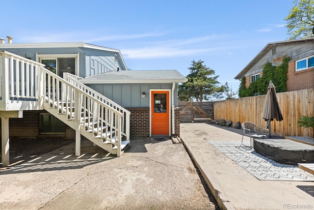 4381 Dixon Dr, Westminster, CO 80031 - entrance to property featuring brick siding and board and batten siding