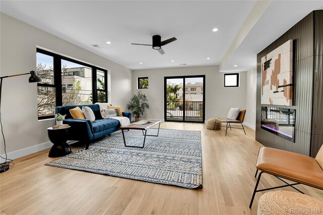 2162 S Ash St, Denver, CO 80222 - living room with a ceiling fan, light wood-type flooring, baseboards, and recessed lighting