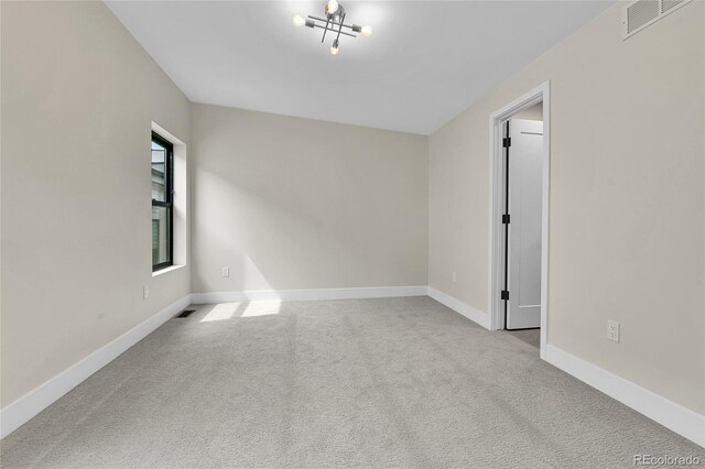 2162 S Ash St, Denver, CO 80222 - carpeted spare room featuring baseboards