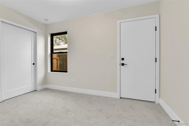 2162 S Ash St, Denver, CO 80222 - unfurnished bedroom featuring carpet floors, baseboards, and a closet