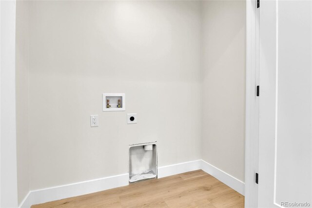 2162 S Ash St, Denver, CO 80222 - washroom with electric dryer hookup, hookup for a washing machine, light wood-style flooring, and baseboards