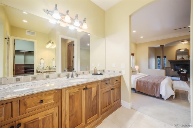 ensuite bathroom with connected bathroom, recessed lighting, vanity, visible vents, and tile patterned floors