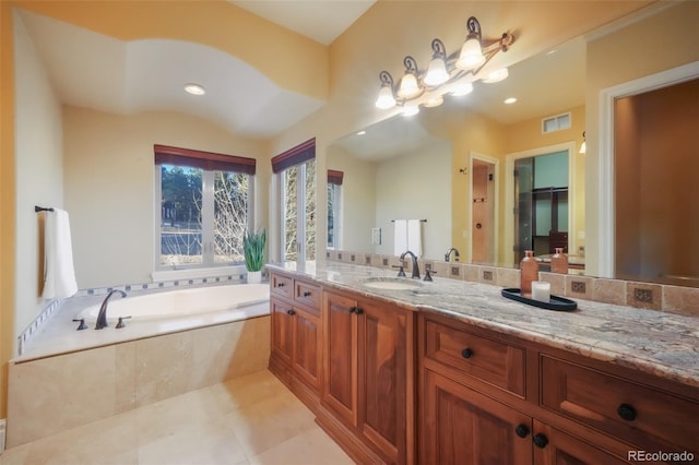 full bath with a garden tub, vanity, visible vents, and tile patterned floors