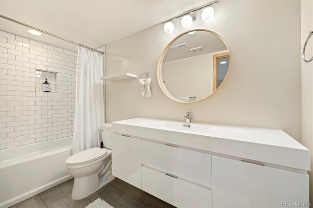 full bathroom with tile patterned floors, visible vents, toilet, vanity, and shower / tub combo with curtain