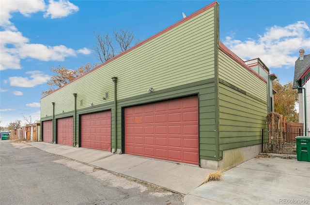 garage with fence