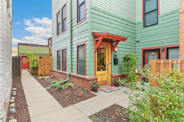property entrance with fence