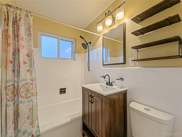 full bathroom featuring a wainscoted wall, vanity, toilet, tile walls, and shower / bath combination with curtain