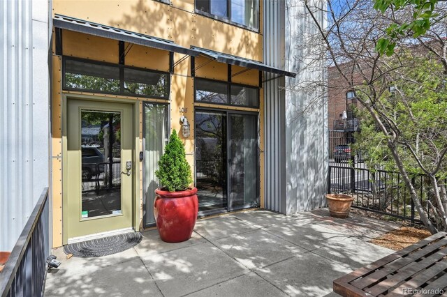 3195 Blake St Unit 106, Denver, CO 80205 - doorway to property featuring a patio