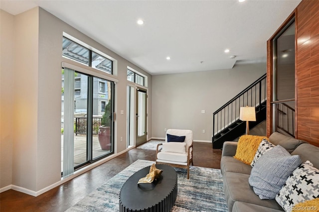 3195 Blake St Unit 106, Denver, CO 80205 - living room featuring stairway, recessed lighting, and baseboards