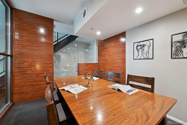 3195 Blake St Unit 106, Denver, CO 80205 - dining area featuring stairway, a textured wall, and recessed lighting
