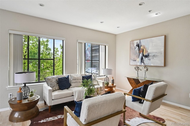 3195 Blake St Unit 106, Denver, CO 80205 - living area featuring wood finished floors, baseboards, and recessed lighting