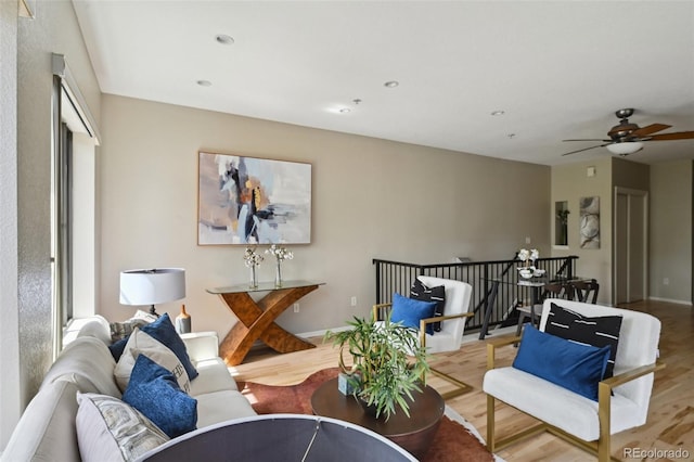 3195 Blake St Unit 106, Denver, CO 80205 - living area with wood finished floors and a ceiling fan