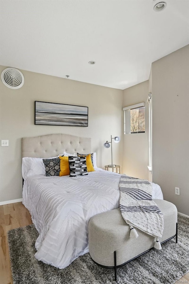 3195 Blake St Unit 106, Denver, CO 80205 - bedroom featuring wood finished floors and baseboards