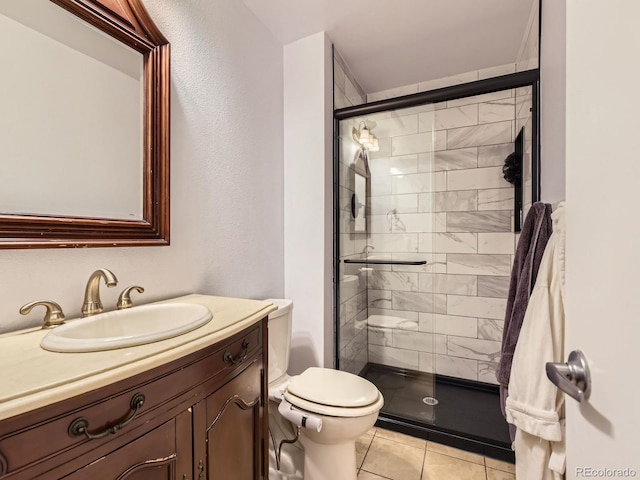 full bathroom with toilet, a stall shower, tile patterned flooring, and vanity