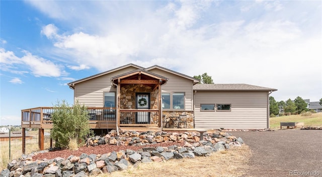 view of front of home featuring a wooden deck