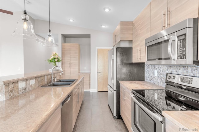 kitchen with sink, appliances with stainless steel finishes, backsplash, hanging light fixtures, and light brown cabinets