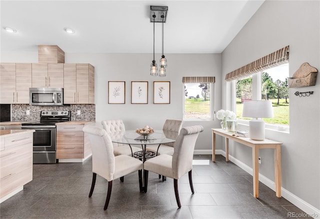 dining area featuring an inviting chandelier