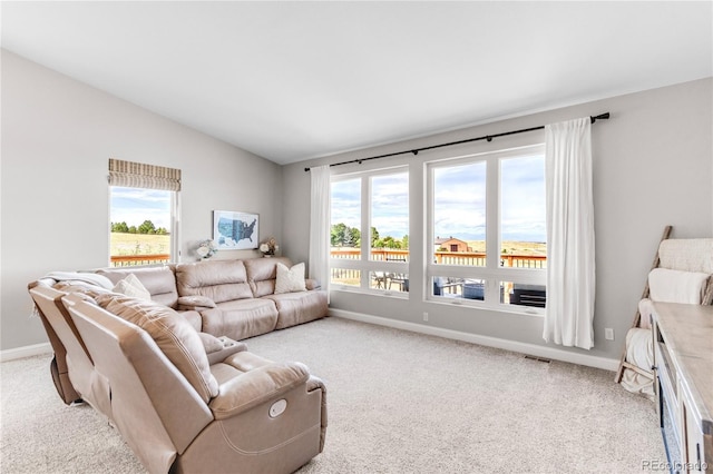 living room featuring vaulted ceiling and light carpet