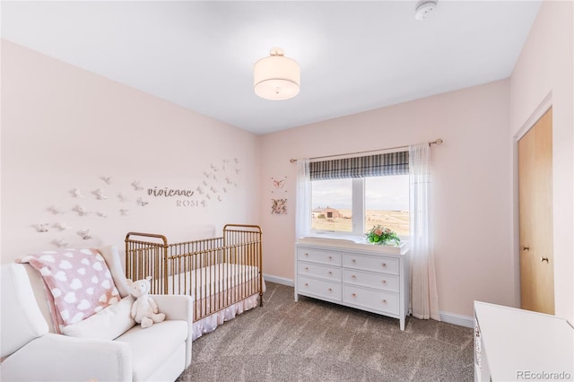 carpeted bedroom featuring a crib