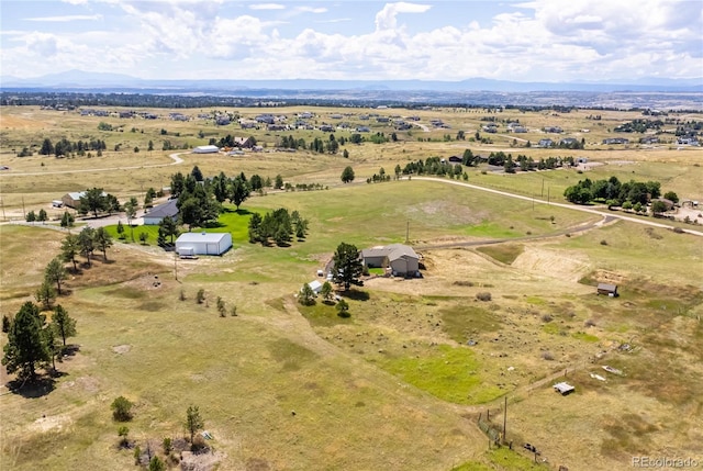 bird's eye view featuring a mountain view and a rural view