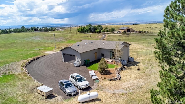 birds eye view of property featuring a mountain view and a rural view