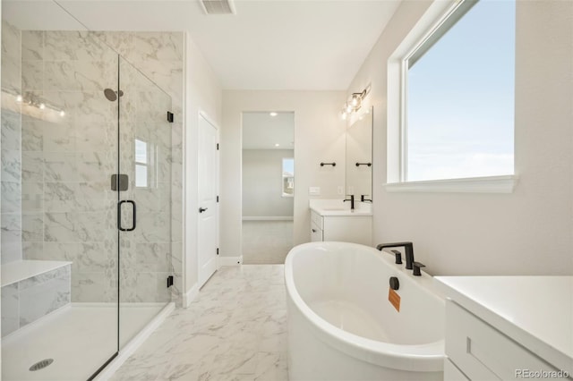 bathroom with vanity, plus walk in shower, and a wealth of natural light