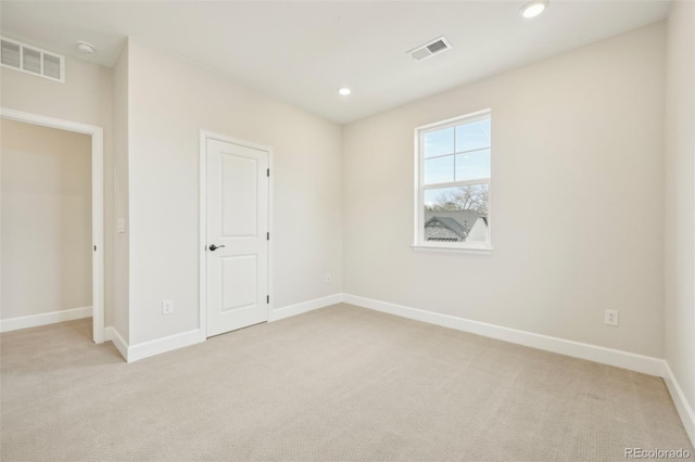 unfurnished bedroom with light colored carpet