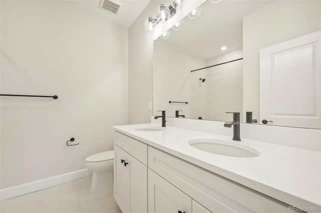 bathroom with a shower, tile patterned flooring, vanity, and toilet