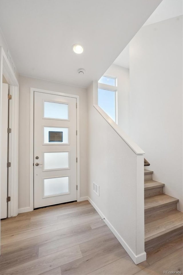 doorway to outside with light hardwood / wood-style flooring