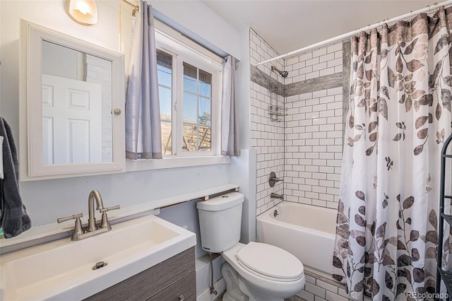 full bathroom featuring vanity, toilet, and shower / bath combo with shower curtain