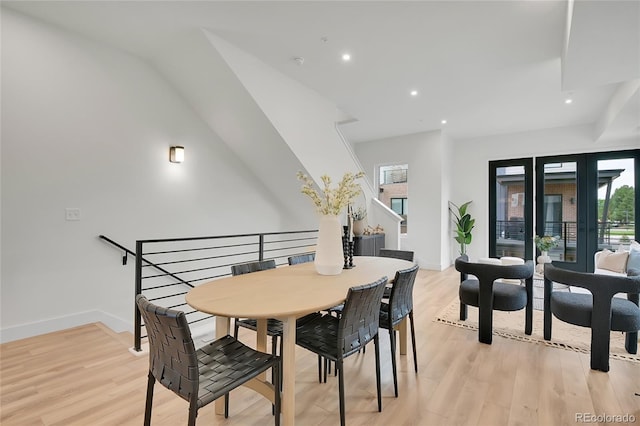 dining space with light hardwood / wood-style flooring