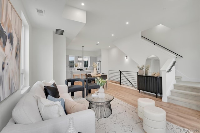 living room with light hardwood / wood-style floors