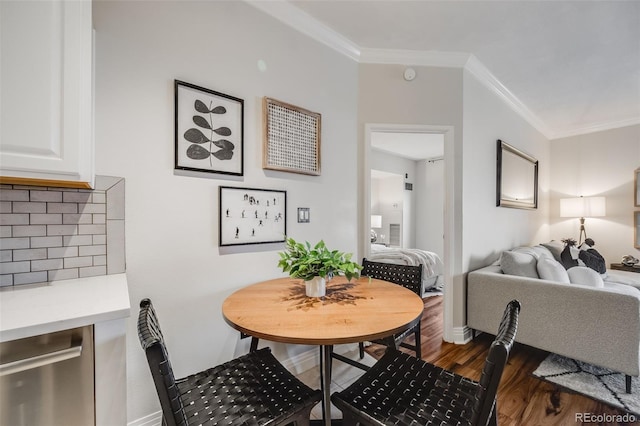 601 W 11th Ave Unit 1101, Denver, CO 80204 - dining area with crown molding, dark wood-style floors, and baseboards