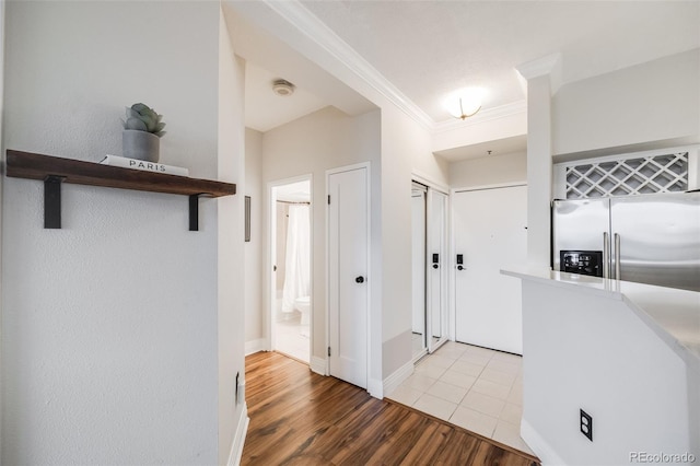 601 W 11th Ave Unit 1101, Denver, CO 80204 - hallway with crown molding, light wood-style flooring, and baseboards