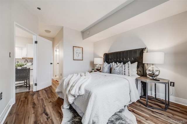 601 W 11th Ave Unit 1101, Denver, CO 80204 - bedroom with wood finished floors and baseboards