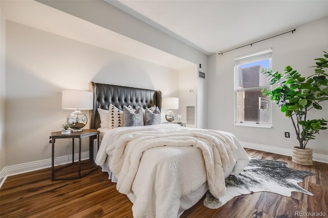 601 W 11th Ave Unit 1101, Denver, CO 80204 - bedroom with baseboards and wood finished floors
