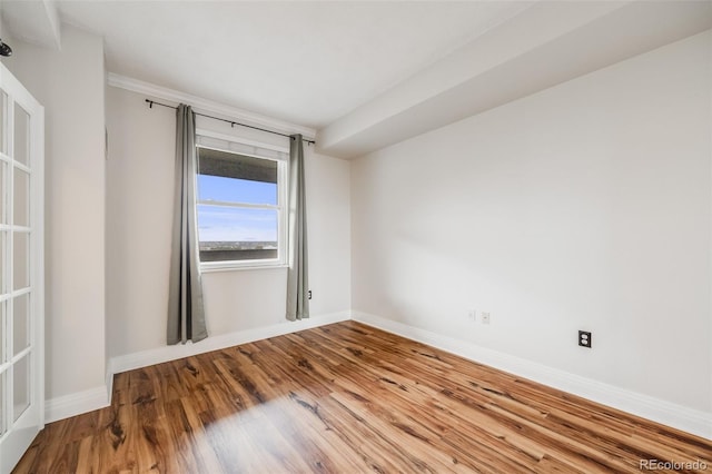 601 W 11th Ave Unit 1101, Denver, CO 80204 - unfurnished room with wood finished floors and baseboards